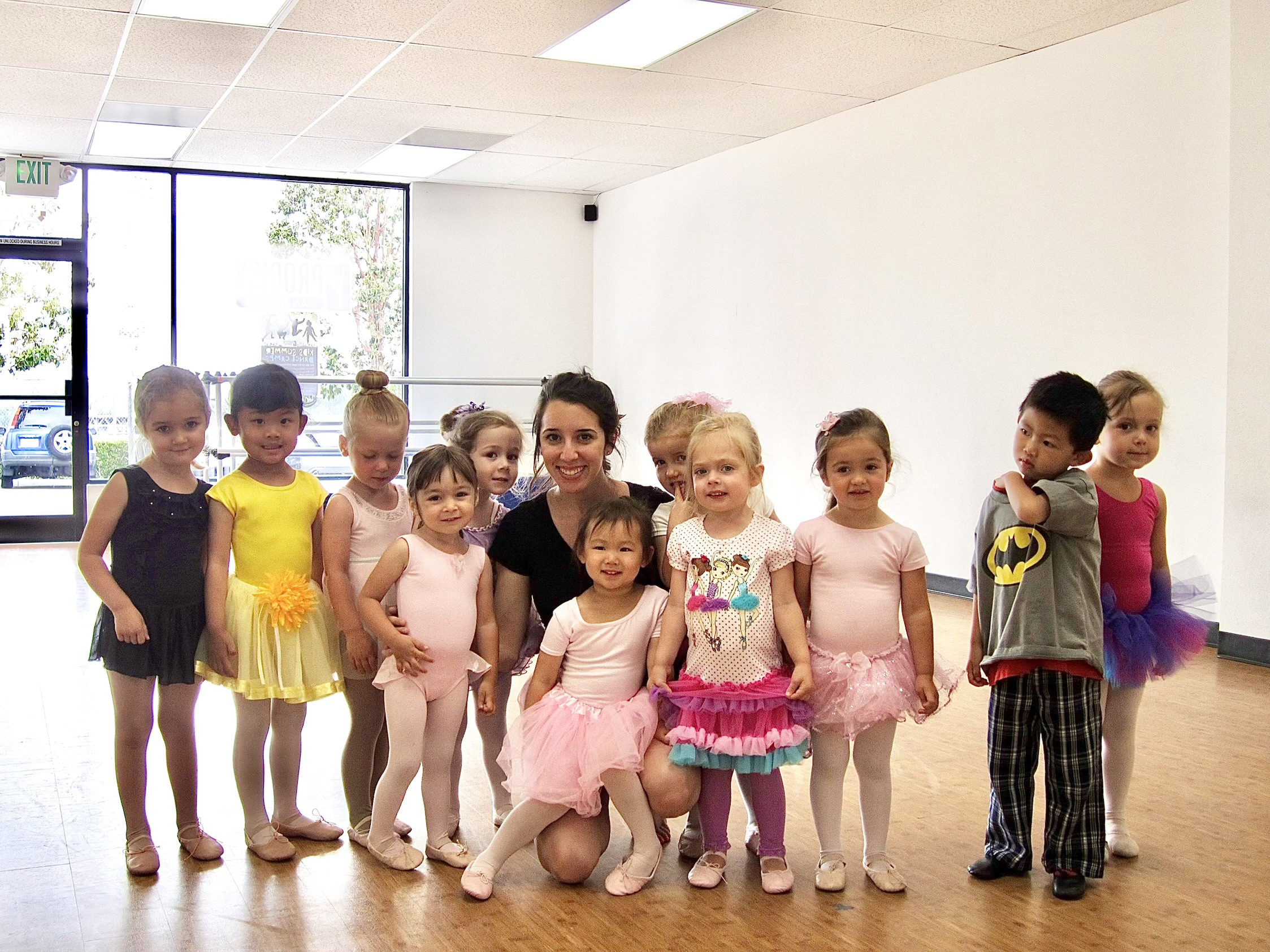 Mel with her dance class of young students