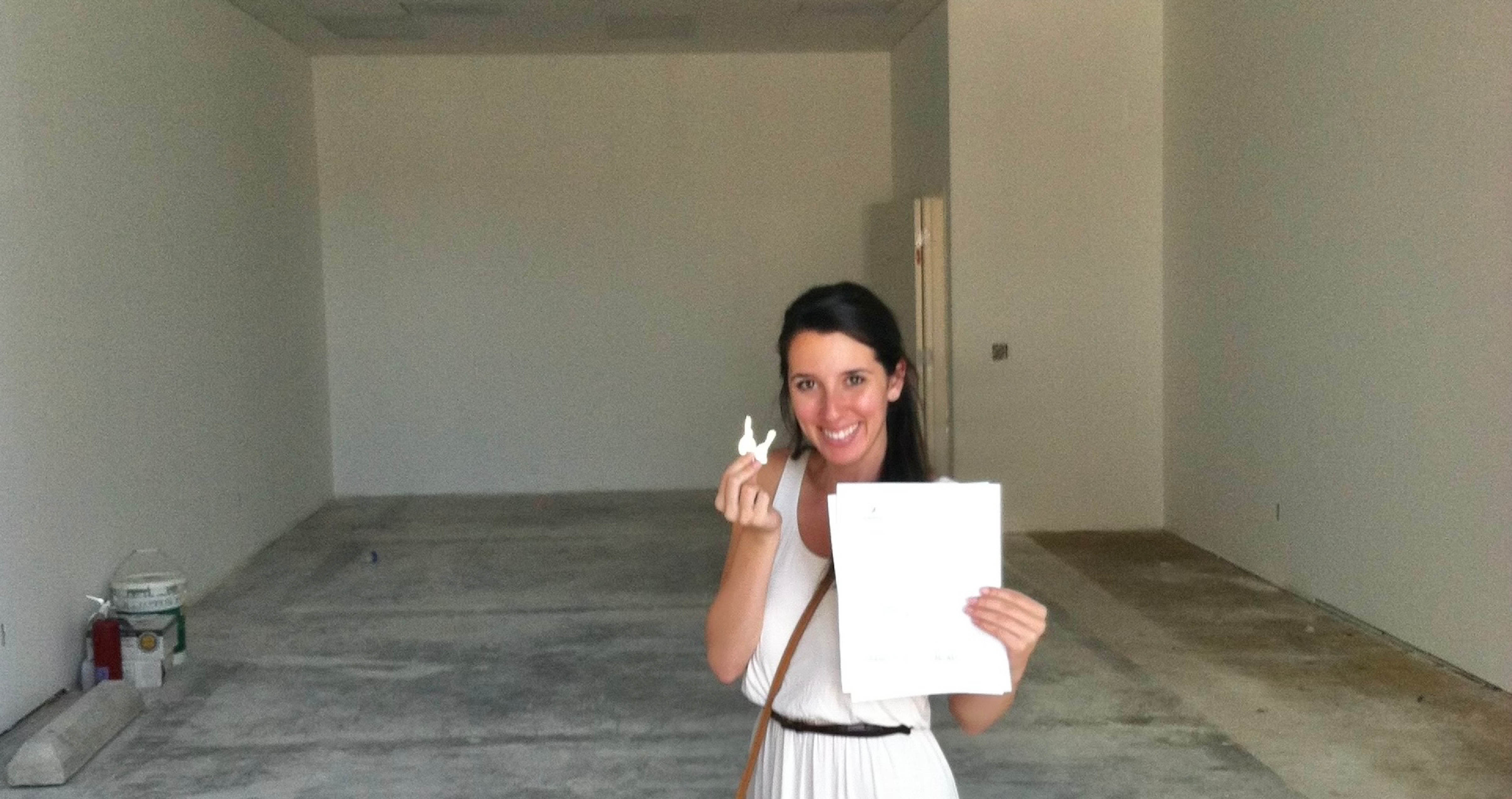 Mel holding the keys and lease to her new dance studio