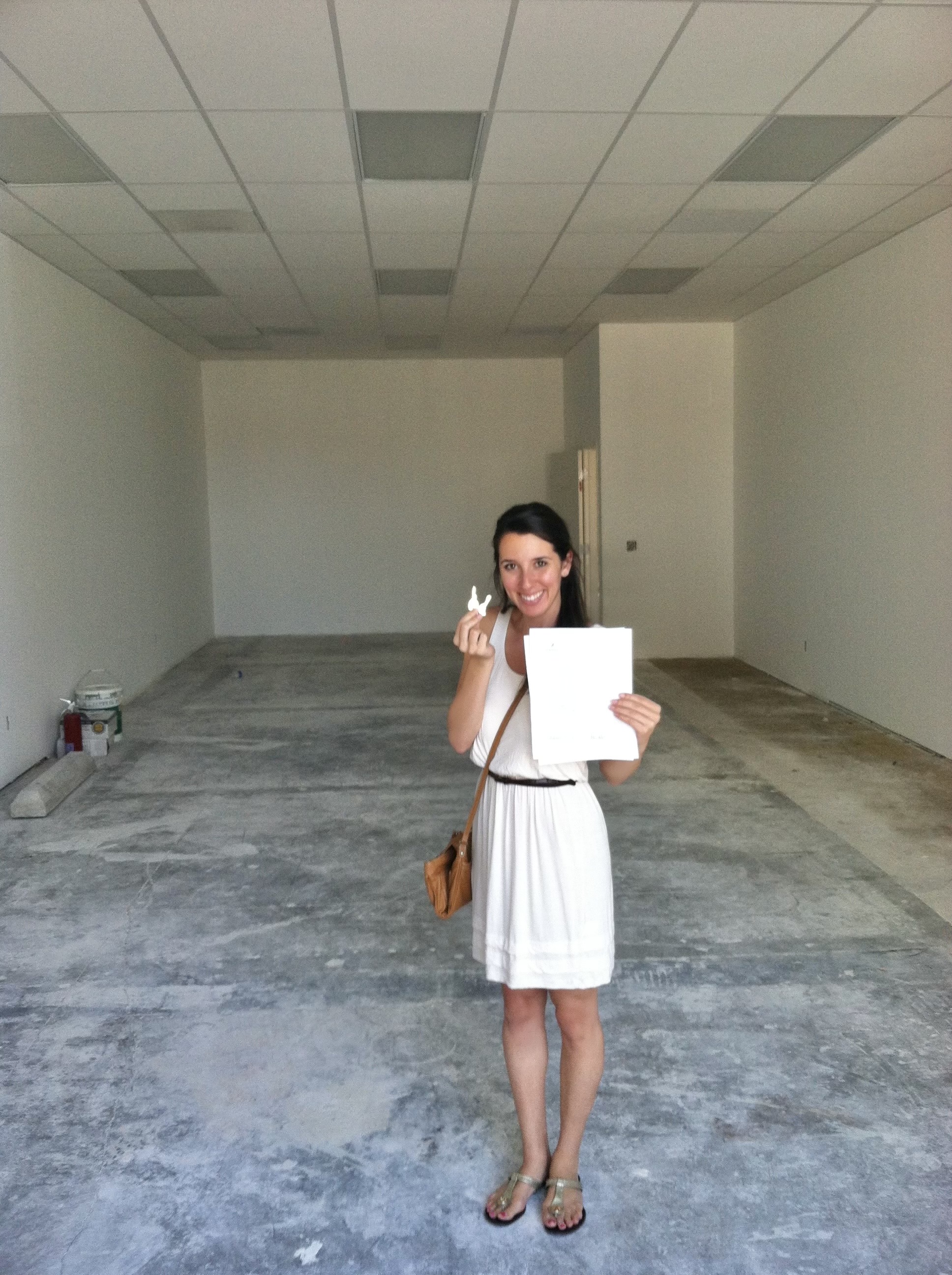Mel holding the keys to her new studio
